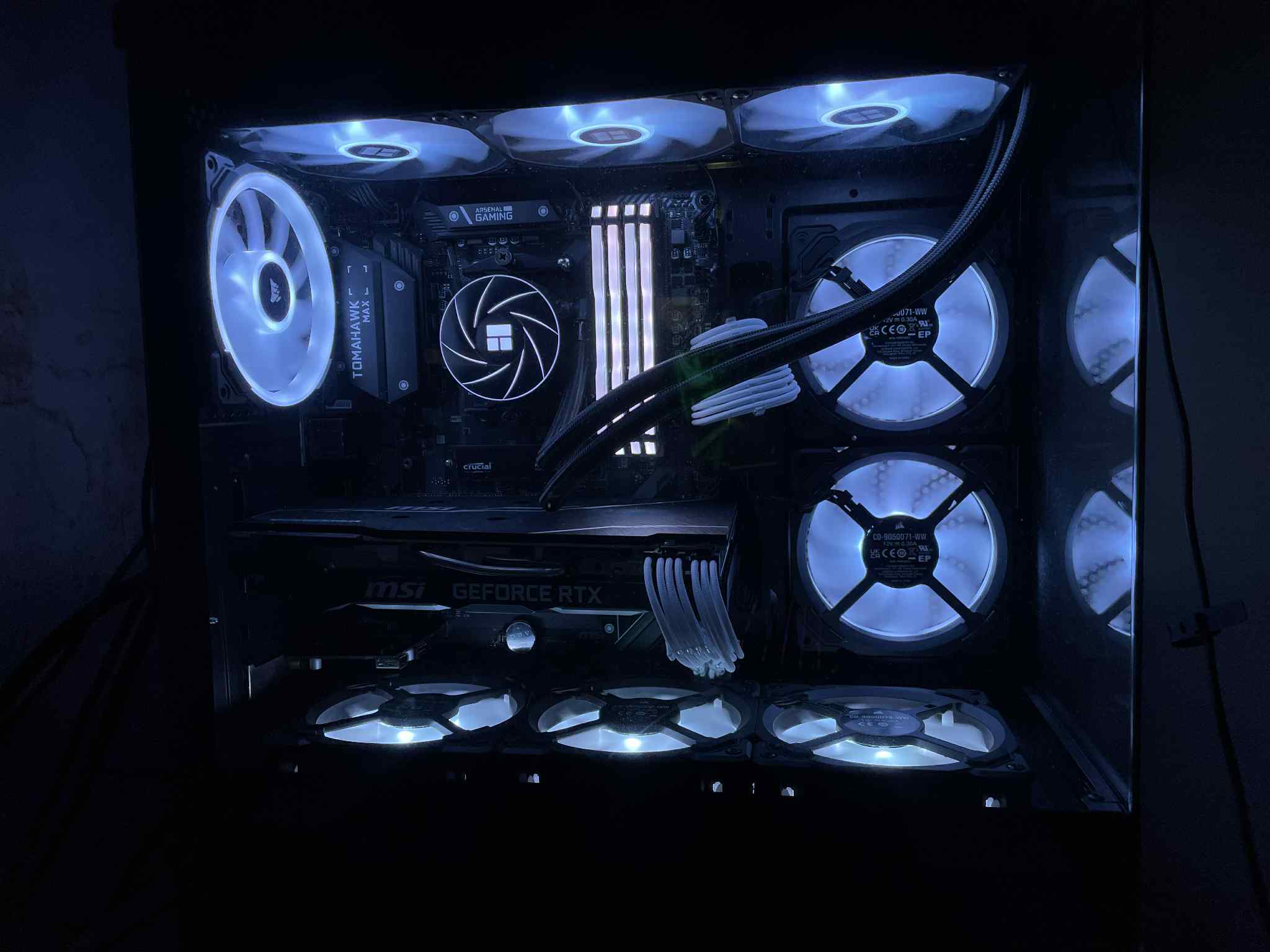 A clean white and black build with blue accents, emphasizing symmetry and tidy cable management. A great choice for users who want a crisp, premium-looking gaming system.