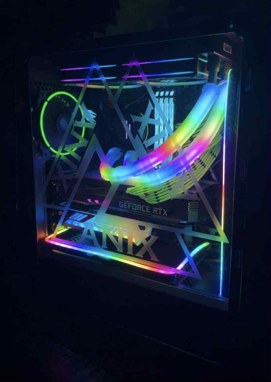 A dynamic RGB showcase build with a multi-color lighting profile. Highlights include strong airflow, excellent internal visibility, and a playful yet high-performance aesthetic.